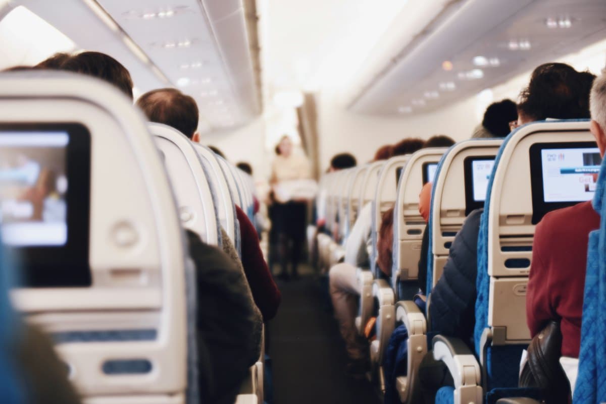 Passengers seated inside an aircraft cabin