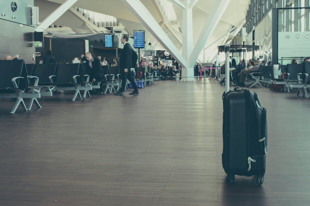 A suitcase waiting in an airport departure hall